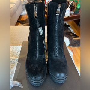 Emanuel Castro black zip boots.